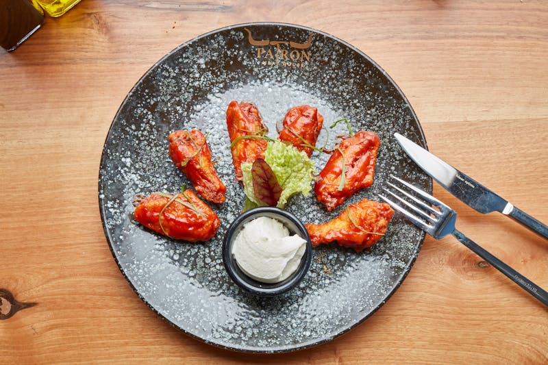 Crispy buffalo chicken wings at Marcos